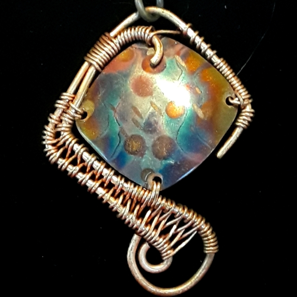 Hand Crafted Copper Pendant Wrapped with copper wire.